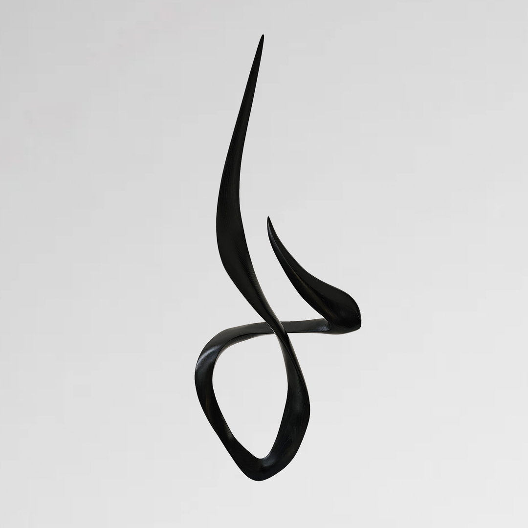 Sleek black abstract sculpture with elongated, curved points and fluid looping form.