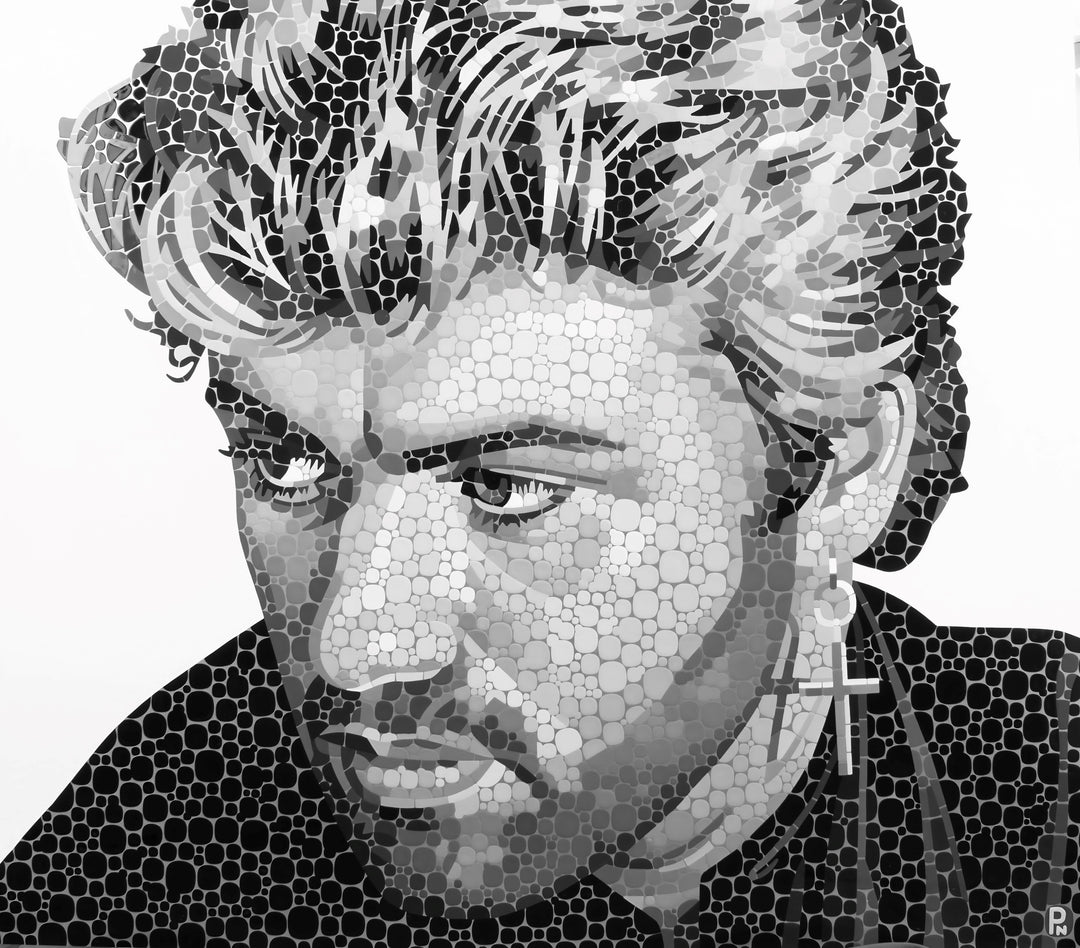 Black and white mosaic portrait of a man with a cross earring and styled hair.