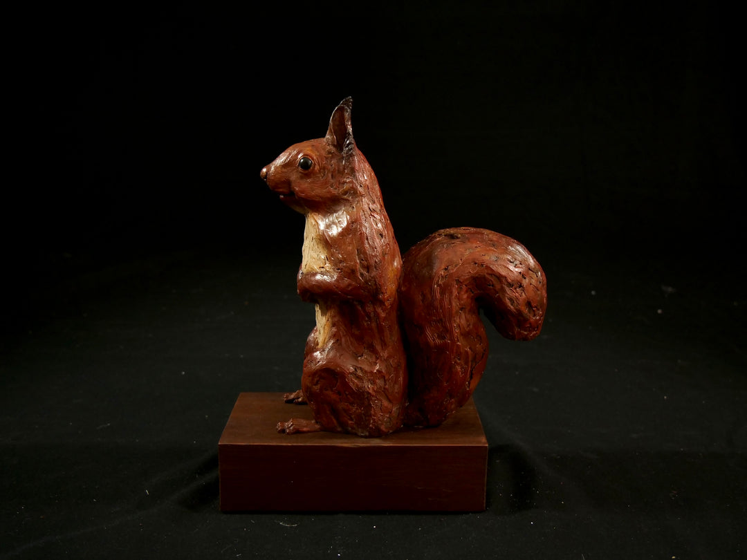 Cold cast iron sculpture of a red squirrel titled Chancekin by Jamie Lord — finely detailed woodland animal with russet red coat, cream chest, bushy tail and bright black eyes, poised in alert curiosity. Limited edition of 24 with signed Certificate of Authenticity.