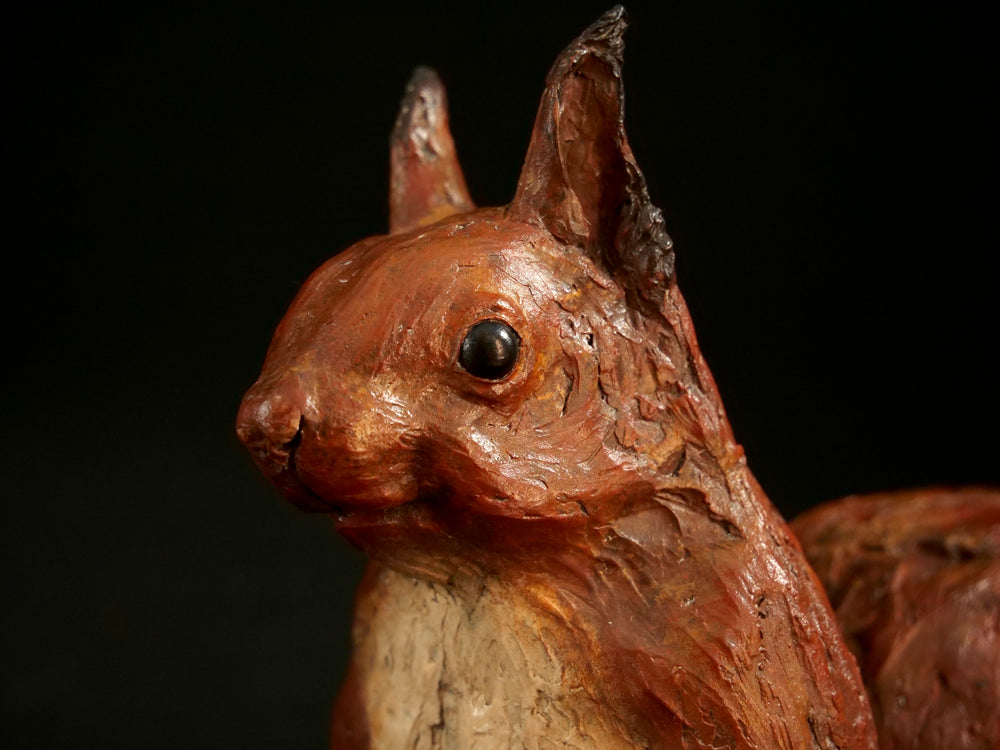 Cold cast iron sculpture of a red squirrel titled Chancekin by Jamie Lord — finely detailed woodland animal with russet red coat, cream chest, bushy tail and bright black eyes, poised in alert curiosity. Limited edition of 24 with signed Certificate of Authenticity.
