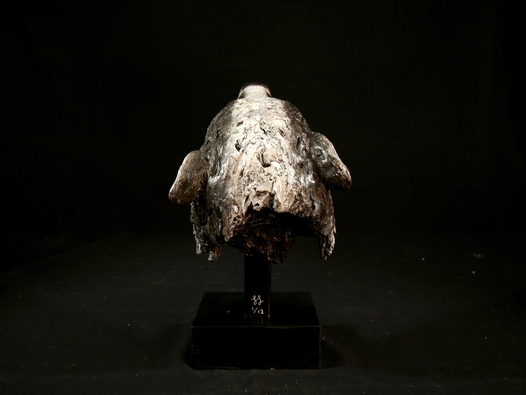 Cold cast slate sculpture of a badger titled Remnant by Jamie Lord — expressive woodland animal bust with textured black-and-grey fur, soft white facial markings, and an upward, reflective gaze. Limited edition of 12 with signed Certificate of Authenticity.