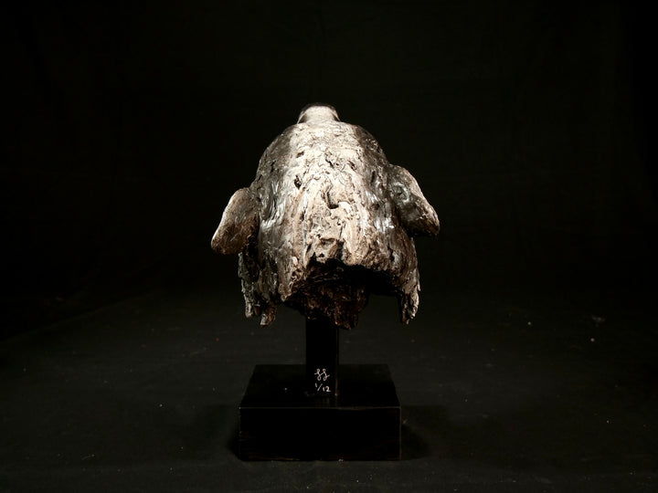 Cold cast slate sculpture of a badger titled Remnant by Jamie Lord — expressive woodland animal bust with textured black-and-grey fur, soft white facial markings, and an upward, reflective gaze. Limited edition of 12 with signed Certificate of Authenticity.