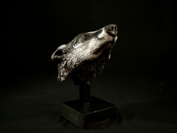 Cold cast slate sculpture of a badger titled Remnant by Jamie Lord — expressive woodland animal bust with textured black-and-grey fur, soft white facial markings, and an upward, reflective gaze. Limited edition of 12 with signed Certificate of Authenticity.