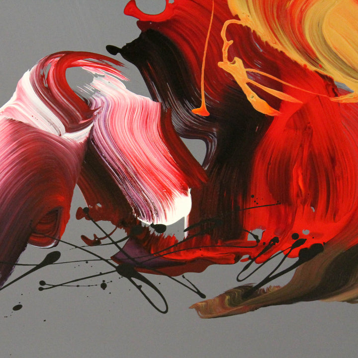 An expressive abstract acrylic painting on square canvas featuring bold, gestural brushstrokes in red, magenta, gold, burnt sienna, and black. The background is a smooth grey taupe, offering a neutral contrast to the vivid, swirling forms. The composition conveys dynamic movement and emotion, with layered, ribbon-like textures and flicks of paint that give a sense of energy and rhythm.