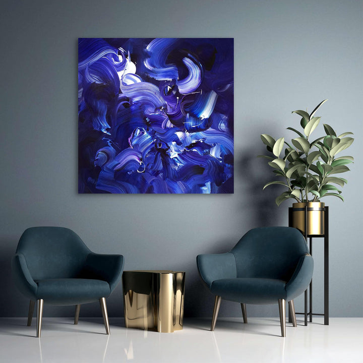 Expressive abstract painting featuring sweeping brushstrokes in deep indigo, cobalt blue, violet, and accents of white. The layered composition creates a sense of fluid motion, depth, and energy on a midnight-toned canvas.