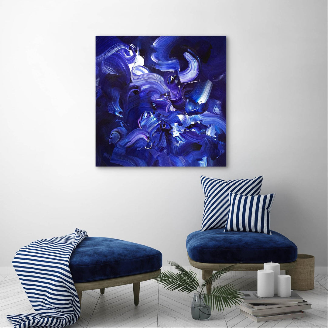 Expressive abstract painting featuring sweeping brushstrokes in deep indigo, cobalt blue, violet, and accents of white. The layered composition creates a sense of fluid motion, depth, and energy on a midnight-toned canvas.