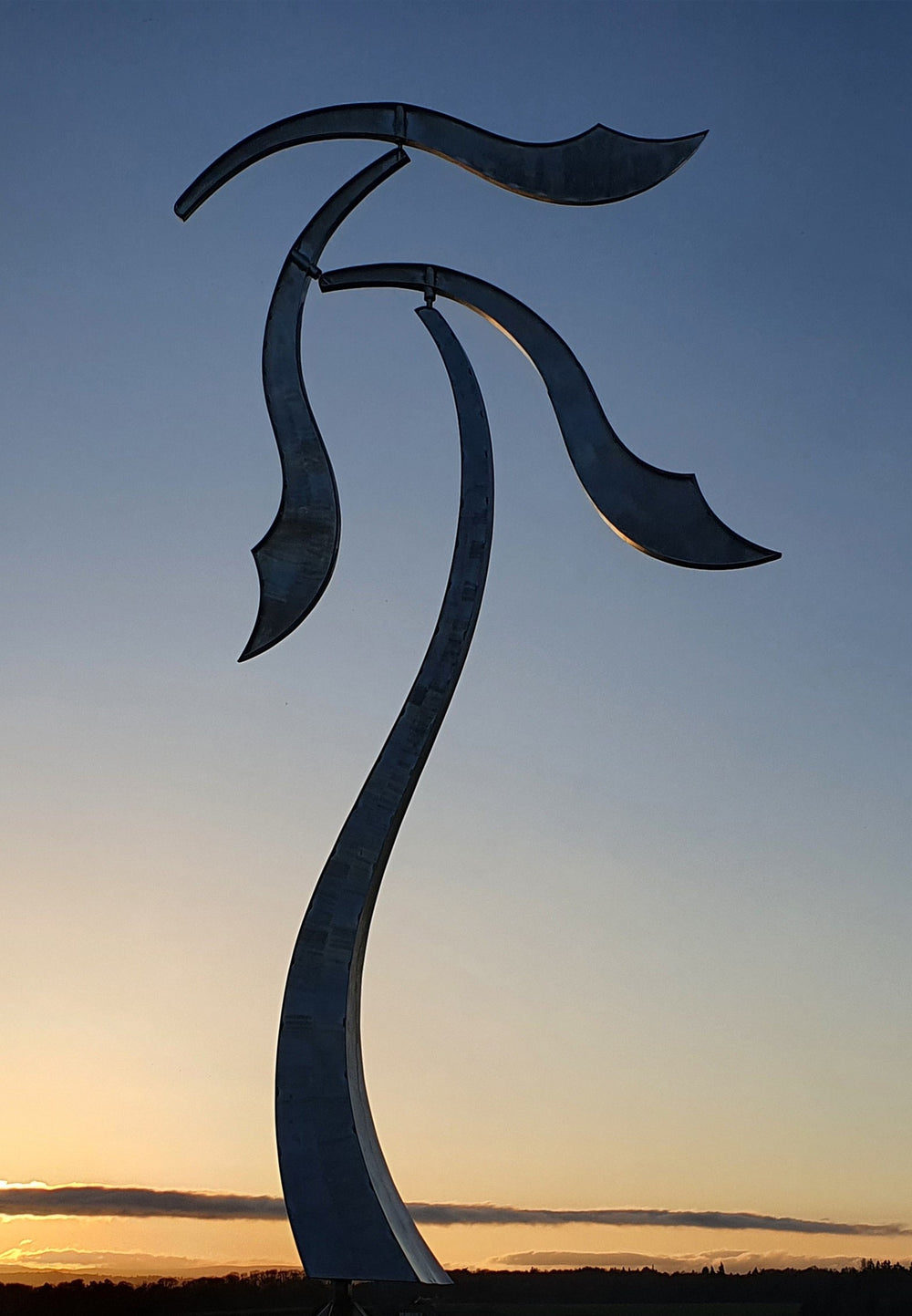 Abstract stainless steel kinetic sculpture with wind-responsive curved elements designed to shift and flow with natural movement
