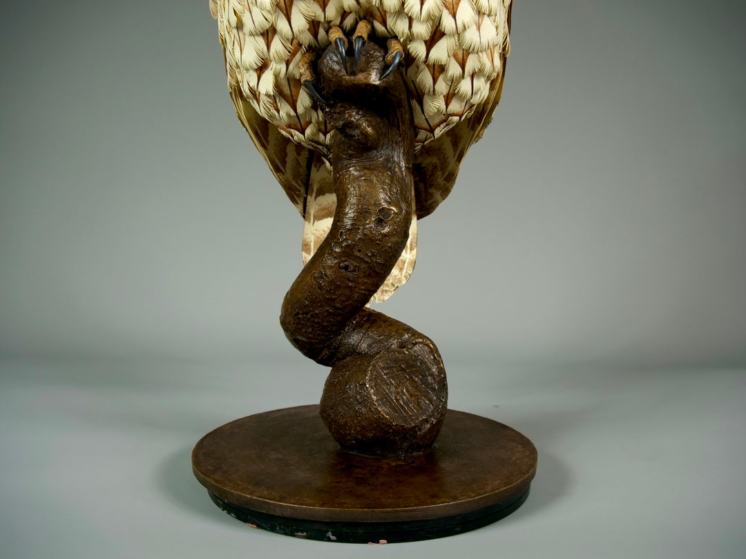 Nocturne tawny owl sculpture by Jamie Lord with layered archival paper feathers and cold cast bronze base on branch
