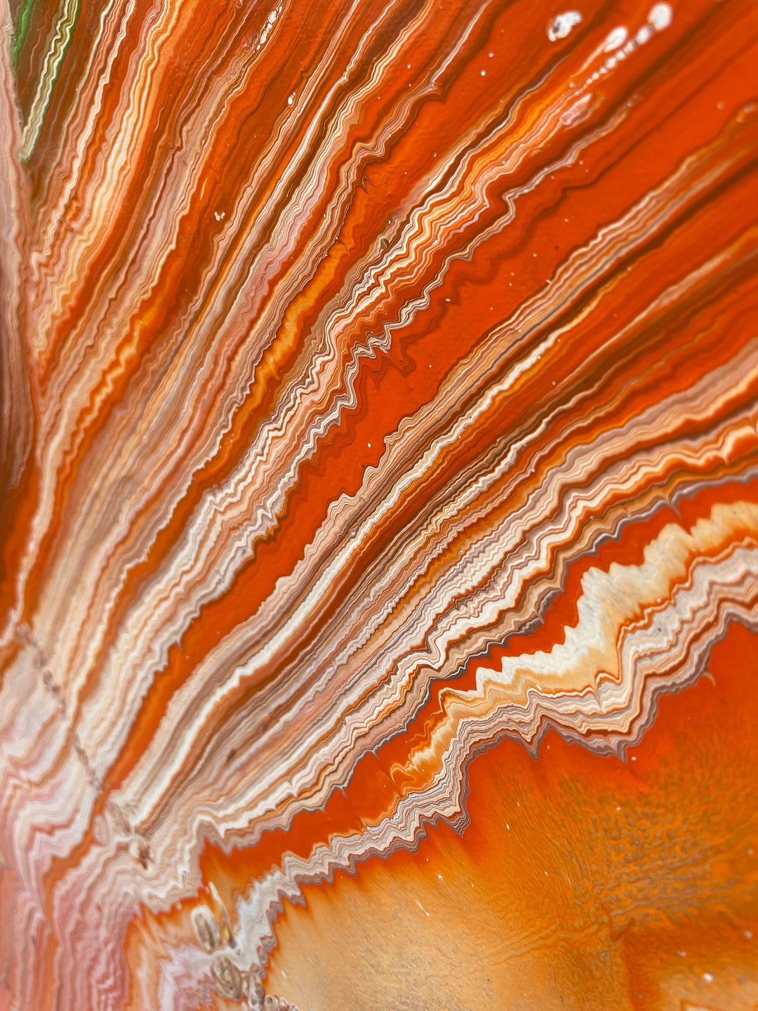 Large vibrant abstract painting “Sun Chaser” by Swarez — a powerful composition of swirling, layered colour featuring vivid yellow bursts cutting across deep oranges, fiery reds, rich magentas, lush greens, electric blues, dark purples and intense black accents. Complex ribbons and rivers of enamel paint create fluid movement and luminous depth on a grand-scale canvas.
