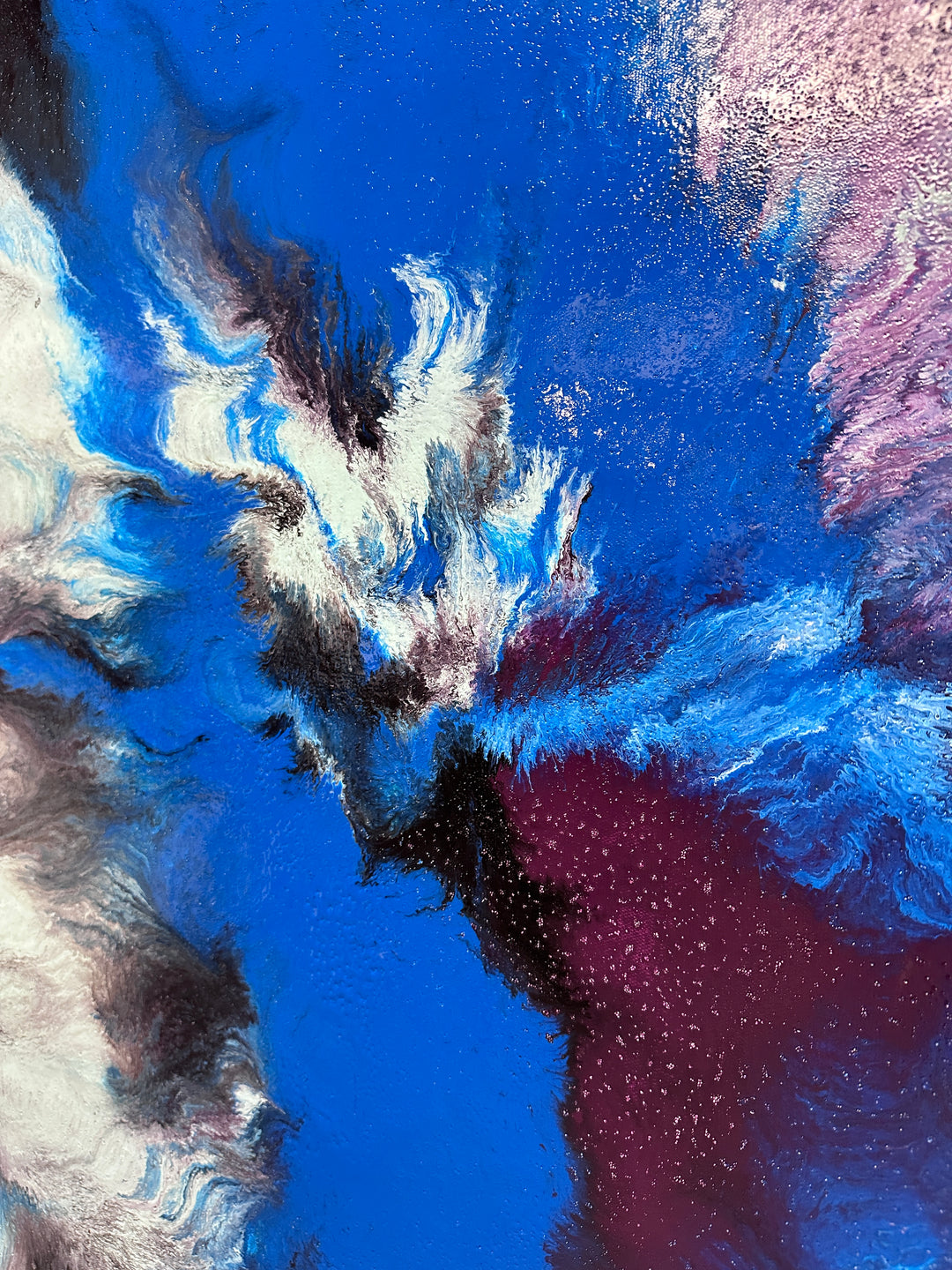 Large abstract painting “Atomic Butterfly” by Swarez — dramatic centrifugal spin art with explosive bursts of cobalt blue, electric turquoise, deep violet purple, crisp white, and black radiating from the centre across a heavily textured enamel surface.