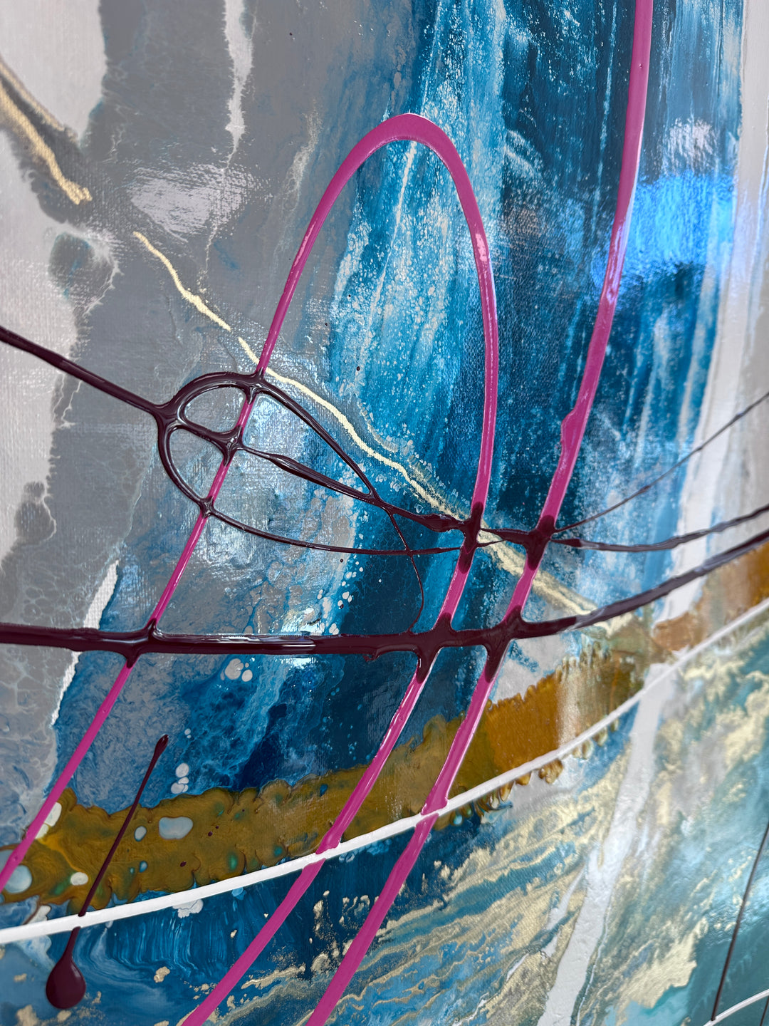 Large abstract painting “Anthus” by Swarez — layered arcs and sweeping semi-circles created with poured enamel paint in deep teal, turquoise, navy blue, warm gold, taupe, light grey, ivory, and accents of vivid magenta and burgundy, finished with a high-gloss, fluid texture on canvas.