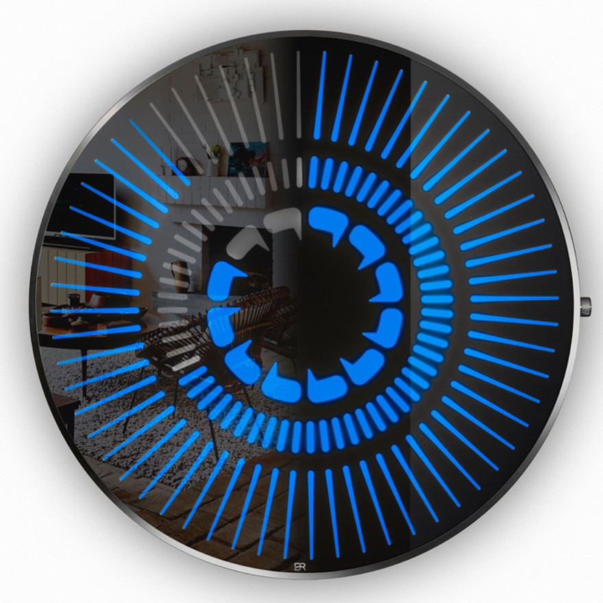 “Tempus Obsidian” by Ben Rousseau – a limited-edition illuminated wall timepiece crafted from grey mirrored glass and brass-tinted aluminium with LEDs. Inspired by obsidian, it radiates calm through subtle light and refined design.

