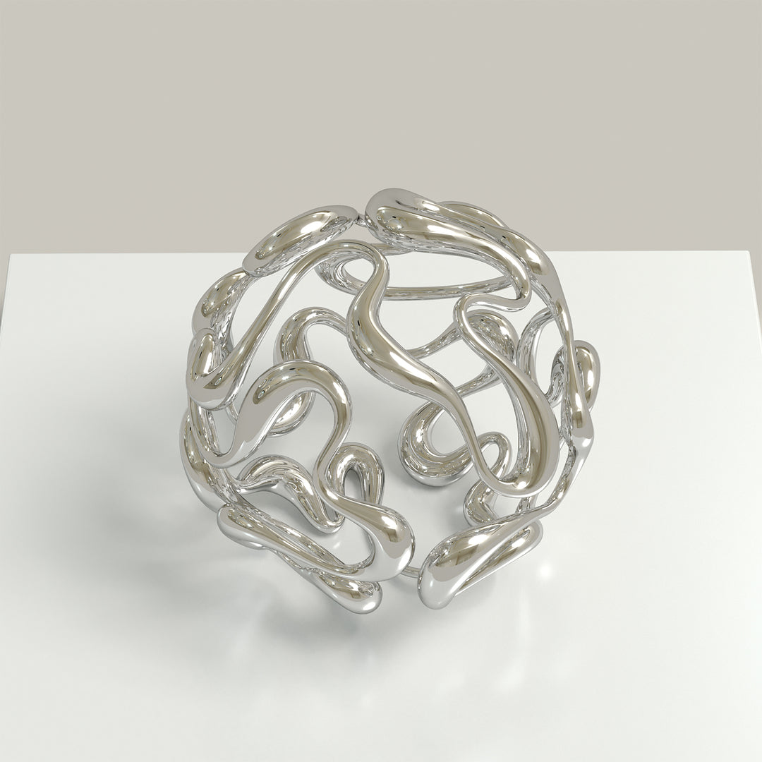 Polished cast stainless steel sculpture by Yoni Alter, formed from a continuous, looping line that weaves organically into a perfect sphere. The reflective surface and open structure create a sense of movement, balance, and fluidity from every angle. Self-standing and orientation-free.