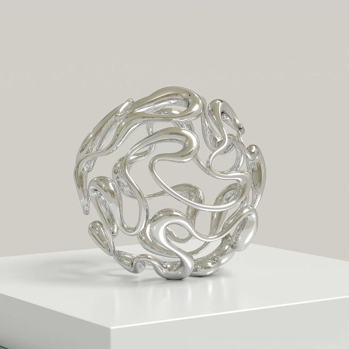 Polished cast stainless steel sculpture by Yoni Alter, formed from a continuous, looping line that weaves organically into a perfect sphere. The reflective surface and open structure create a sense of movement, balance, and fluidity from every angle. Self-standing and orientation-free.