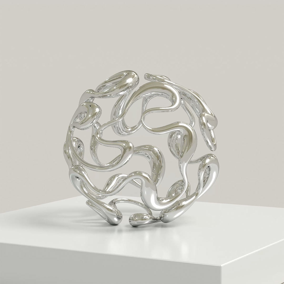Polished cast stainless steel sculpture by Yoni Alter, formed from a continuous, looping line that weaves organically into a perfect sphere. The reflective surface and open structure create a sense of movement, balance, and fluidity from every angle. Self-standing and orientation-free.
