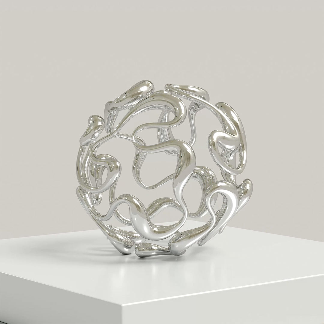 Polished cast stainless steel sculpture by Yoni Alter, formed from a continuous, looping line that weaves organically into a perfect sphere. The reflective surface and open structure create a sense of movement, balance, and fluidity from every angle. Self-standing and orientation-free.