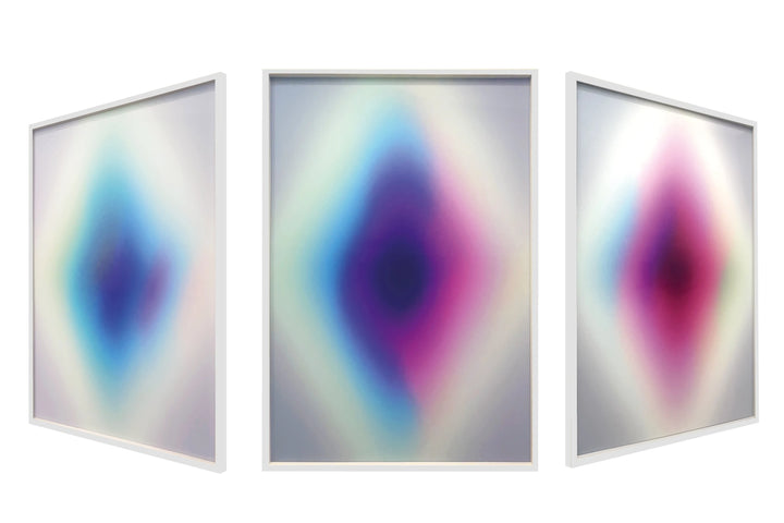 The Opening: Lenticular by Lauren Baker, a limited edition reflective lenticular artwork composed of four abstract paintings, creating shifting gradients of light and colour within a white wood box frame, offering a dynamic visual experience that changes with perspective.