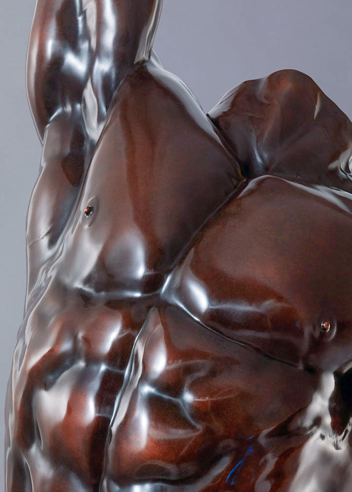 A powerful bronze torso sculpture by Nick Bibby, depicting Apollo with precise classical anatomy, a rich dark-bronze patina, and an upward twisting form displayed on a bronze plinth.