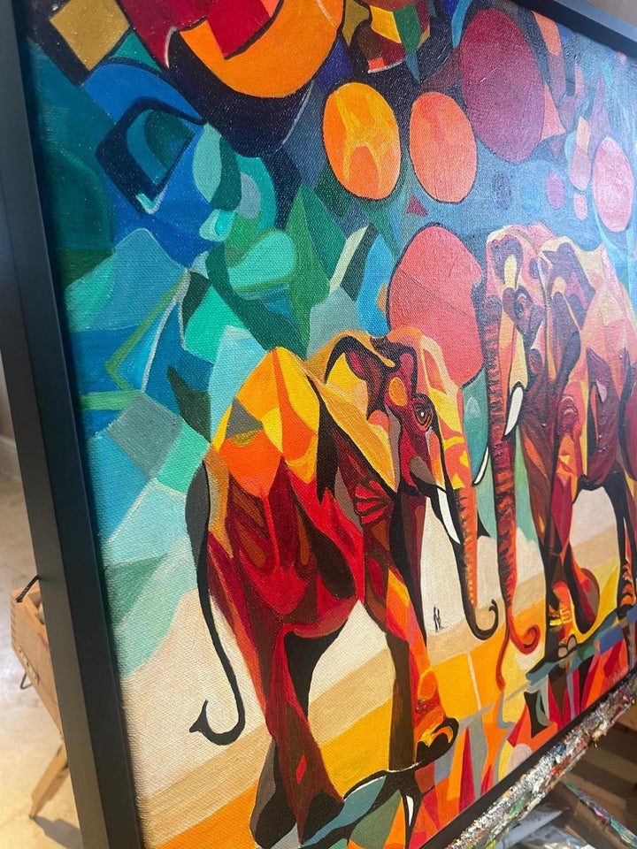 Two abstract elephants in bold, vivid colours with geometric backgrounds and circular sun motifs.

