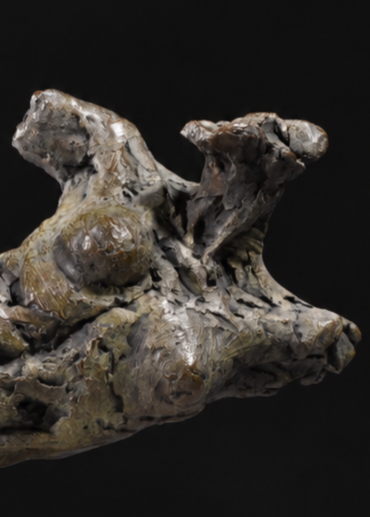‘Nude Emergence Torso’ by Hamish Mackie, a limited-edition contemporary bronze figurative sculpture depicting a fragmented reclining female nude torso. Inspired by ancient sculptural artefacts, the abstracted human form features rough, expressive modelling, weathered surfaces and an earthy brown bronze patina. Mounted horizontally on a rectangular Ancaster Weatherbed stone plinth, the sculpture explores the natural beauty and tactile qualities of the female form.
