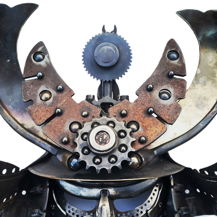 Samurai-inspired helmet sculpture crafted from reclaimed metal with intricate steampunk detailing.