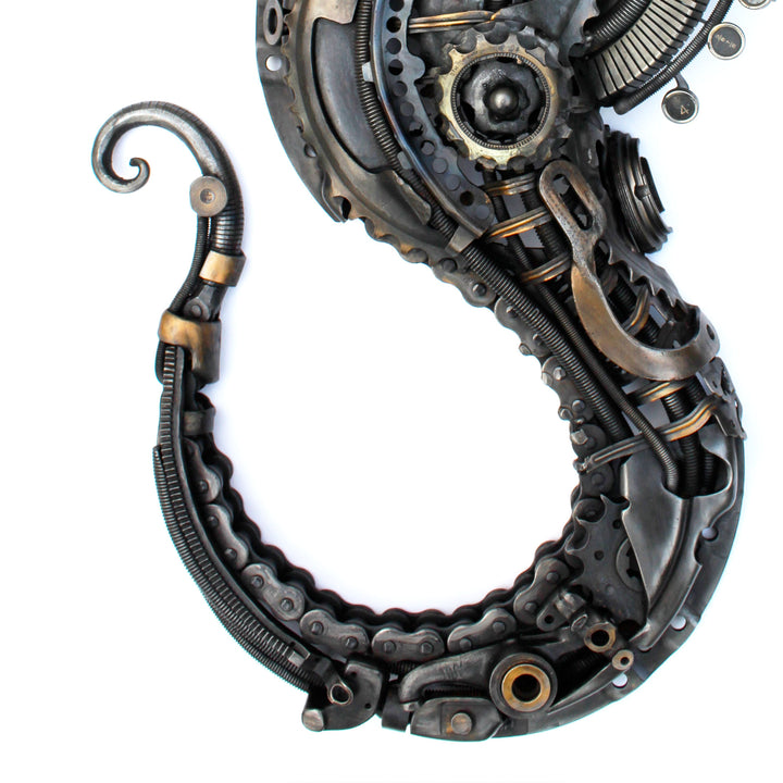 Steampunk-inspired seahorse sculpture made from reclaimed metal, gears, and intricate mechanical components.