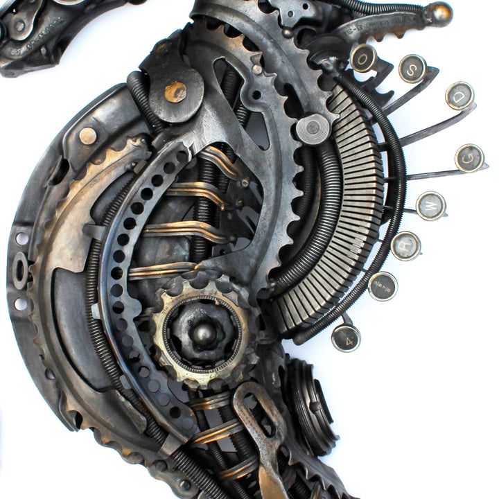 Steampunk-inspired seahorse sculpture made from reclaimed metal, gears, and intricate mechanical components.