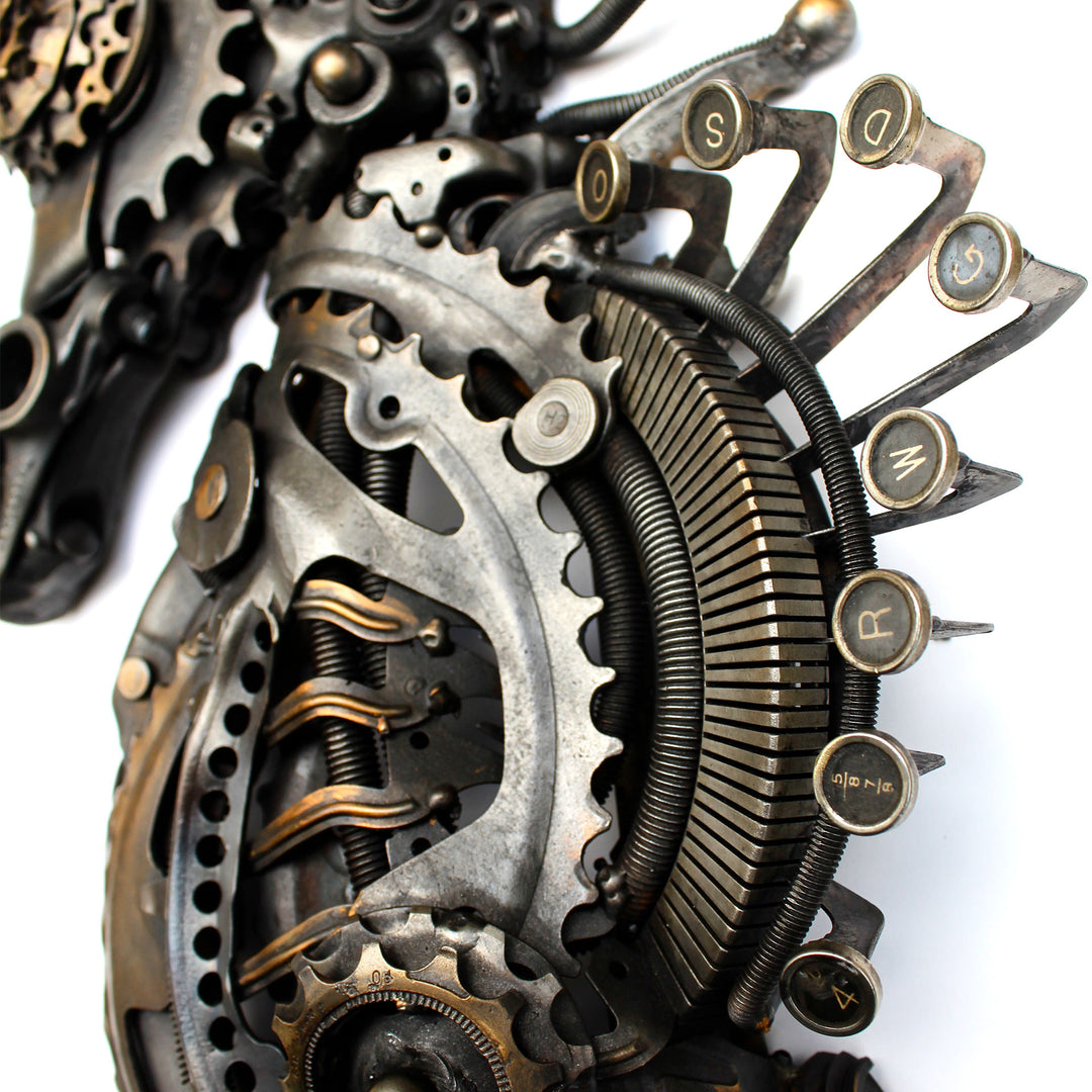 Steampunk-inspired seahorse sculpture made from reclaimed metal, gears, and intricate mechanical components.