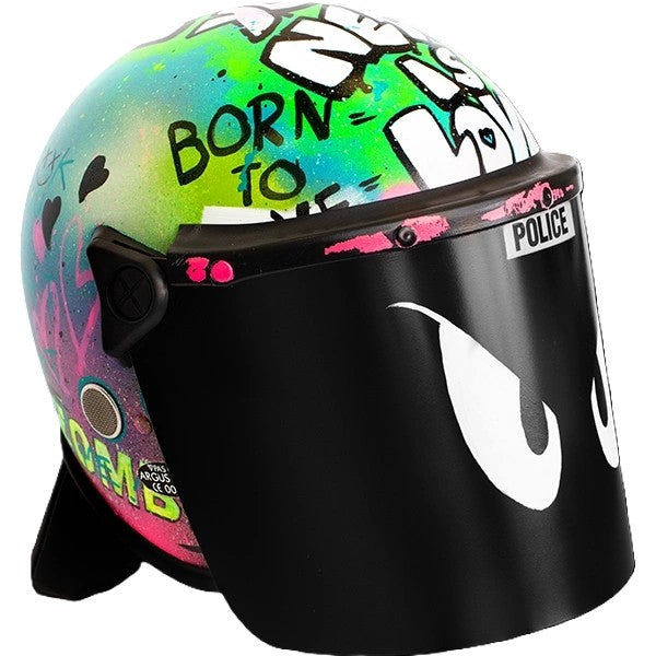 Graffiti-covered police riot helmet with neon colours, bold tags, and the phrase “Born to Love” on a black face shield.