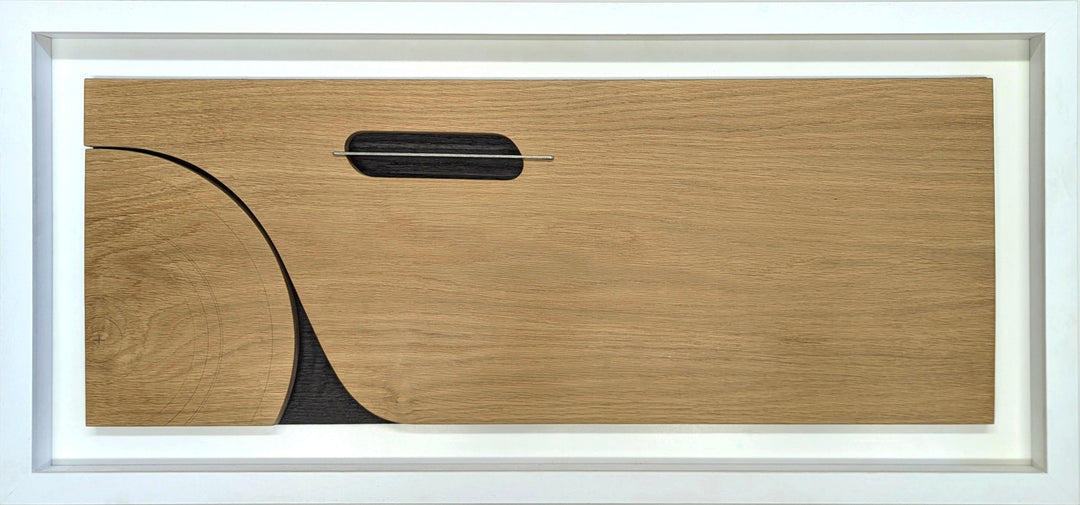 Jonny Ambrose minimalist oak wall sculpture featuring the side profile of an Aston Martin DB5 with carved wheel arch and signature side vent, accented with aluminium detail on a white Corian backdrop.