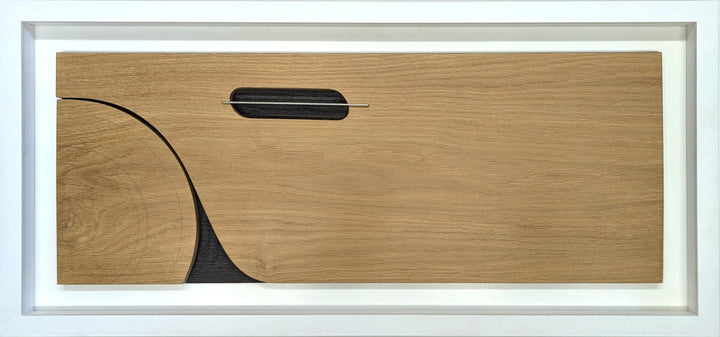 Jonny Ambrose minimalist oak wall sculpture featuring the side profile of an Aston Martin DB5 with carved wheel arch and signature side vent, accented with aluminium detail on a white Corian backdrop.