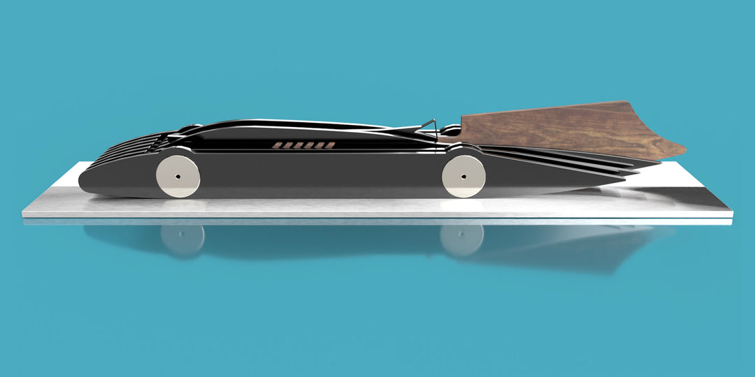 Limited-edition Bluebird V 1935 sculpture by Jonny Ambrose — layered black polished acrylic body with walnut tail-fin and polished nickel-plated aluminium details on a sleek white acrylic or brushed aluminium plinth, celebrating Malcolm Campbell’s 1935 land speed record at Bonneville Salt Flats.