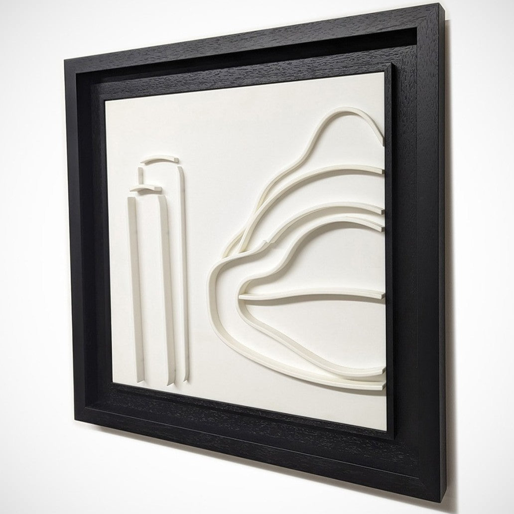 Minimalist white wall sculpture of a 1930s Mercedes W154 Grand Prix car by Jonny Ambrose — abstract flowing lines in thermoformed Corian creating an elegant automotive relief with deep black frame.