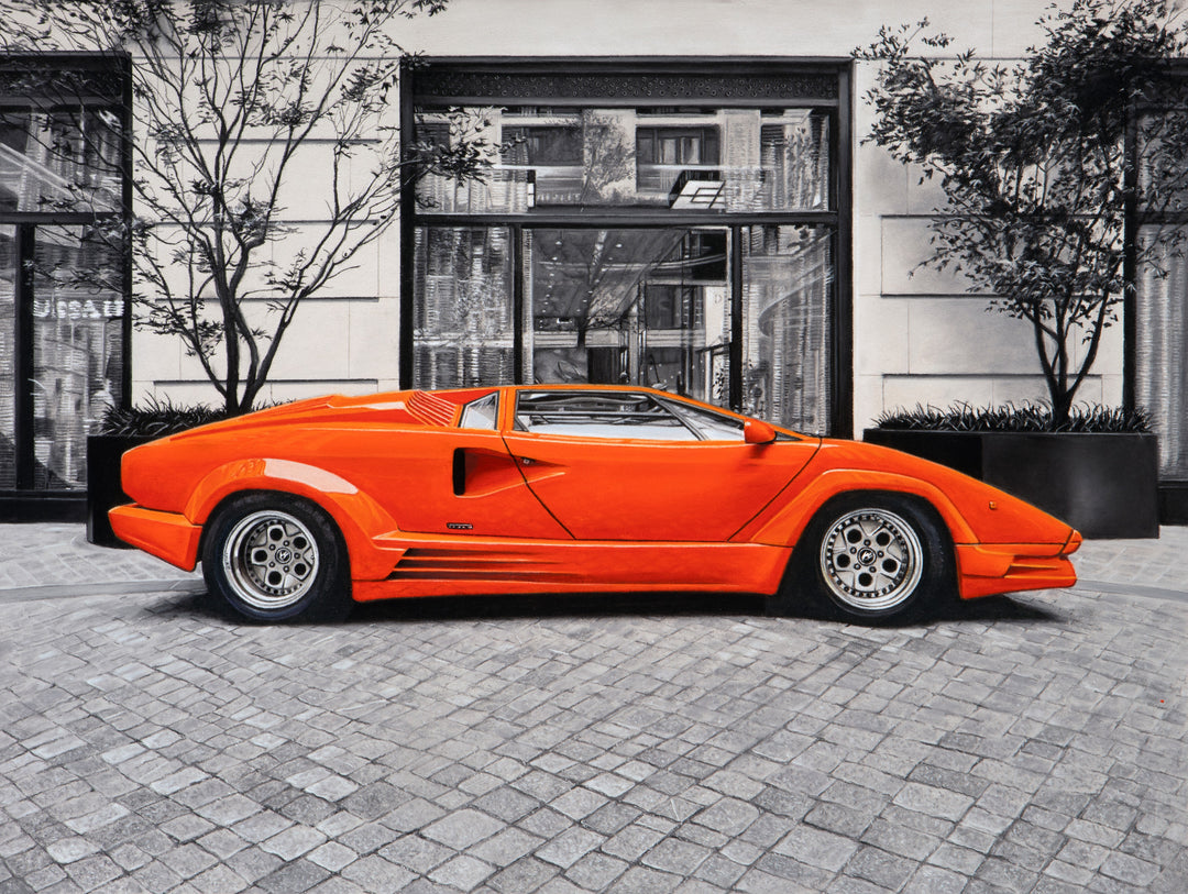 Limited edition giclée print by Ray West depicting an orange Lamborghini Countach 25th Anniversary parked in the courtyard of The Peninsula Hotel London, rendered in hyper-realistic pastel detail with a vivid Arancio Miura body set against a finely detailed monochrome architectural backdrop, printed on archival quality fine art paper.