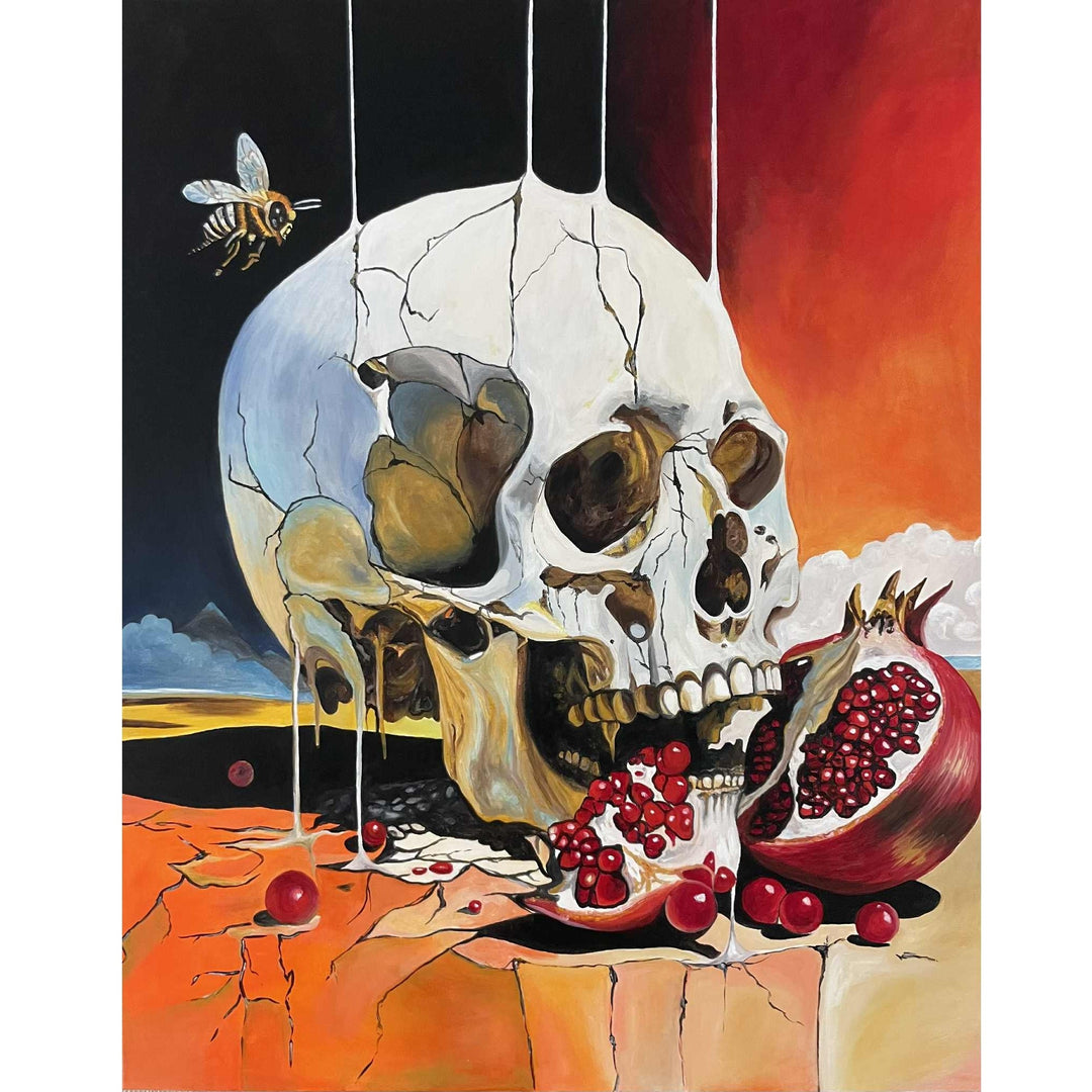 Victoria Saint The Awakening print of a cracked skull biting into a ripe pomegranate with vivid red seeds, set against a surreal landscape, exploring themes of desire, awareness and transformation.