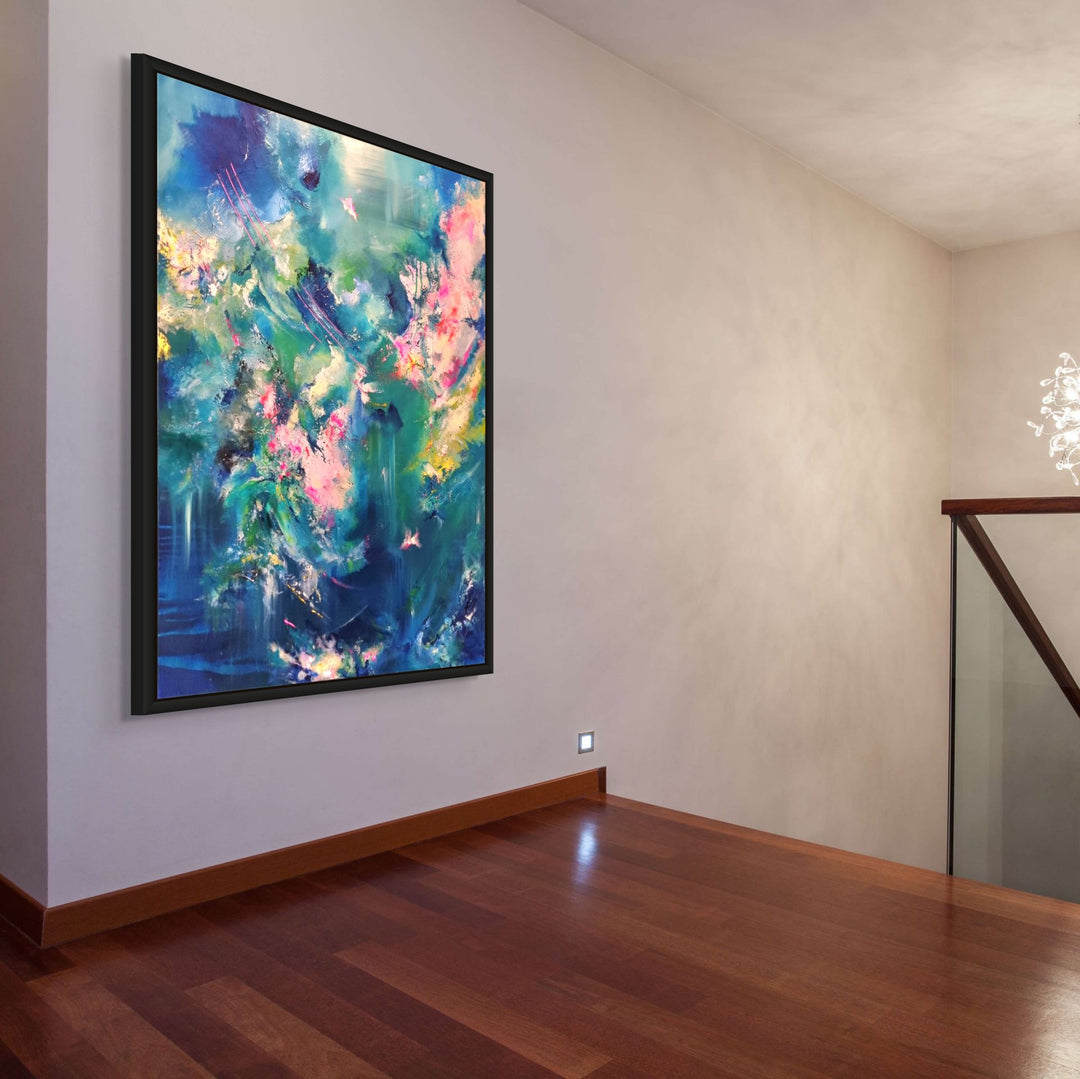 Abstract painting with rich teal, blue and pink tones, layered textures and fluid sweeping movement, framed in a black tray frame.