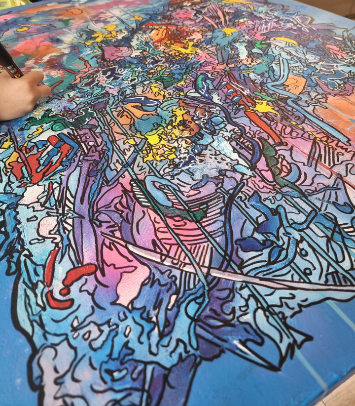 Vibrant abstract artwork in blue, pink and multicoloured layers with expressive graffiti lines, bold colour fields and energetic mark-making, filled with overlapping shapes, textures and movement.