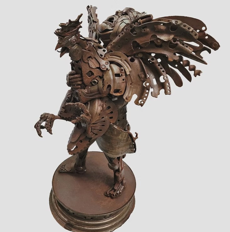 Fantasy warrior sculpture made from reclaimed metal with mechanical wings, gears, and armour detailing.