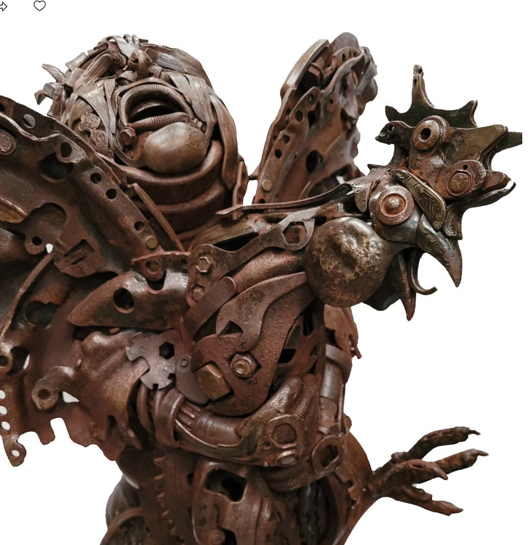 Fantasy warrior sculpture made from reclaimed metal with mechanical wings, gears, and armour detailing.