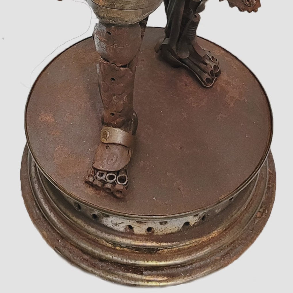 Fantasy warrior sculpture made from reclaimed metal with mechanical wings, gears, and armour detailing.