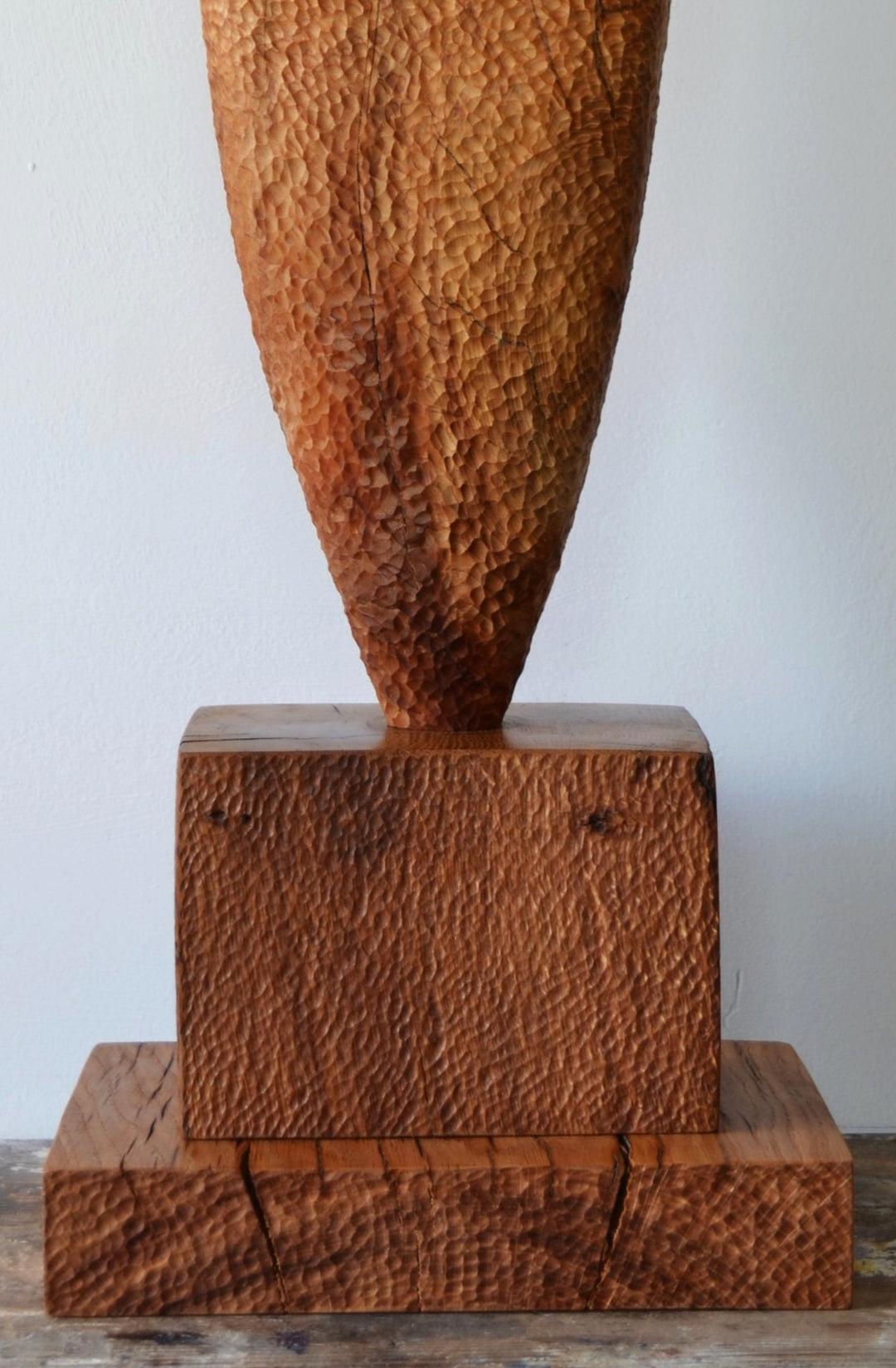 “Camino” by Nicola Beattie – a hand-carved cedar sculpture on an oak base symbolising endurance, renewal, and hope. Part of the Monolith series, it embodies the idea of life’s pilgrimage and the journey toward light and peace.