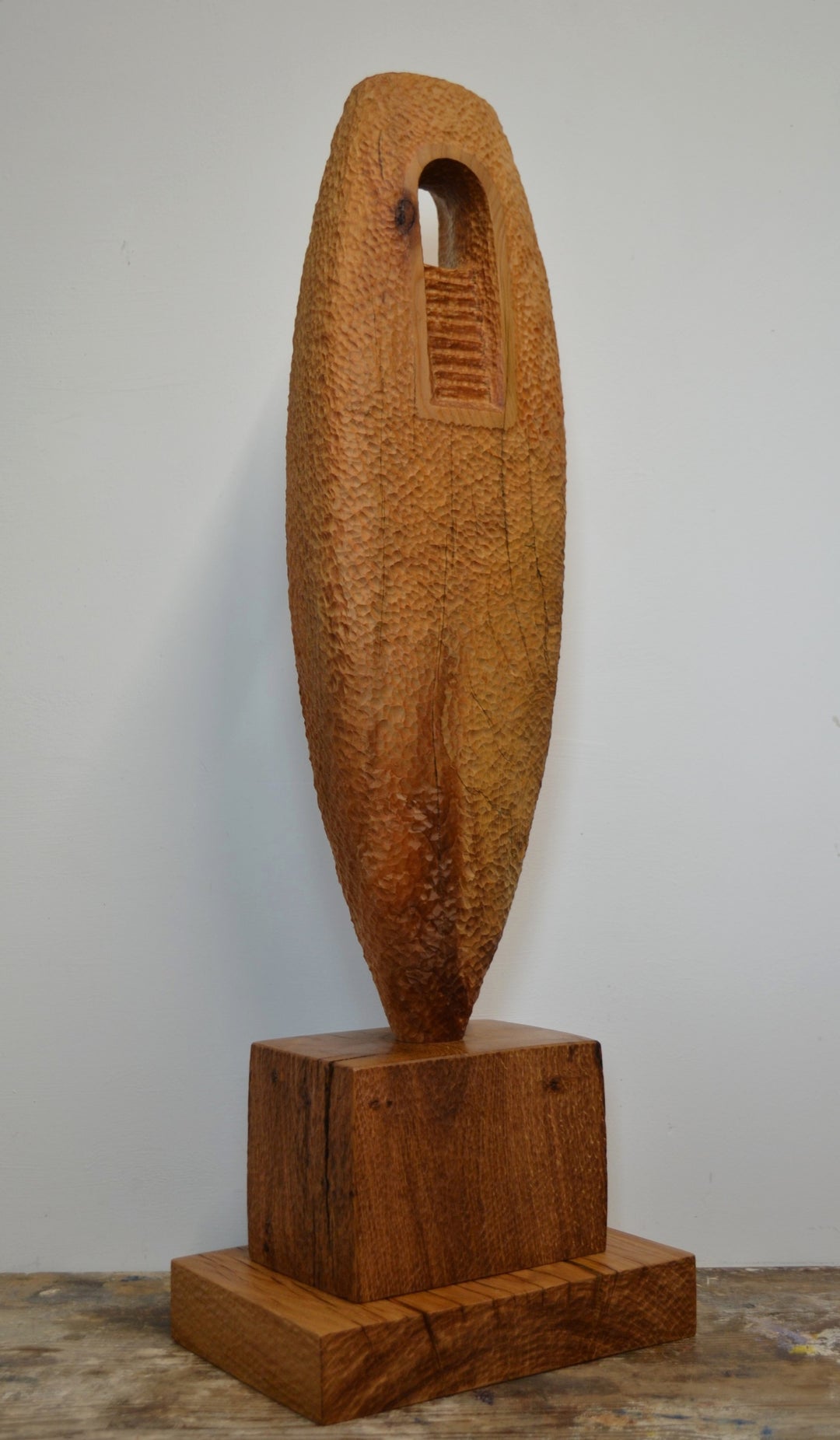 “Camino” by Nicola Beattie – a hand-carved cedar sculpture on an oak base symbolising endurance, renewal, and hope. Part of the Monolith series, it embodies the idea of life’s pilgrimage and the journey toward light and peace.