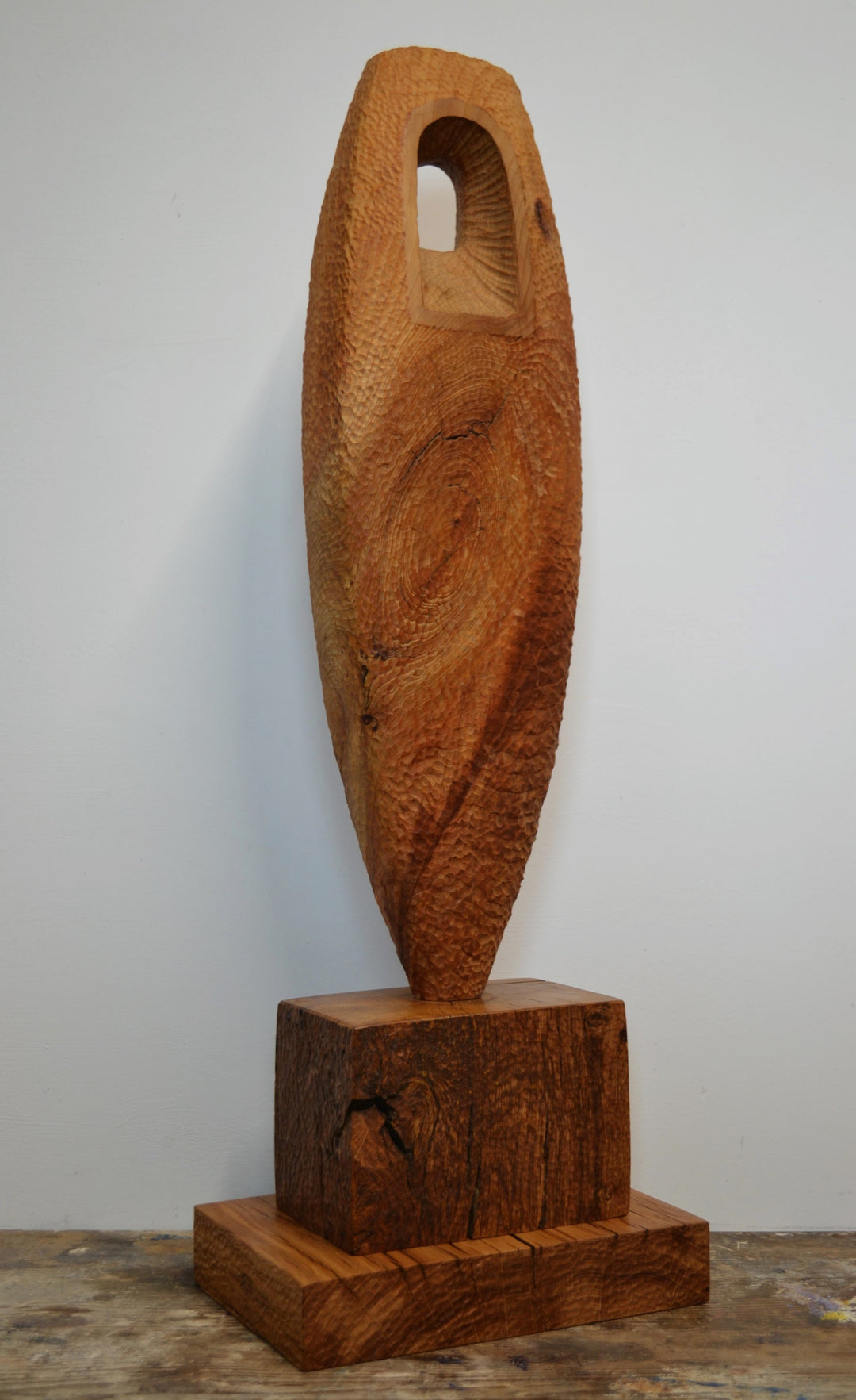“Camino” by Nicola Beattie – a hand-carved cedar sculpture on an oak base symbolising endurance, renewal, and hope. Part of the Monolith series, it embodies the idea of life’s pilgrimage and the journey toward light and peace.