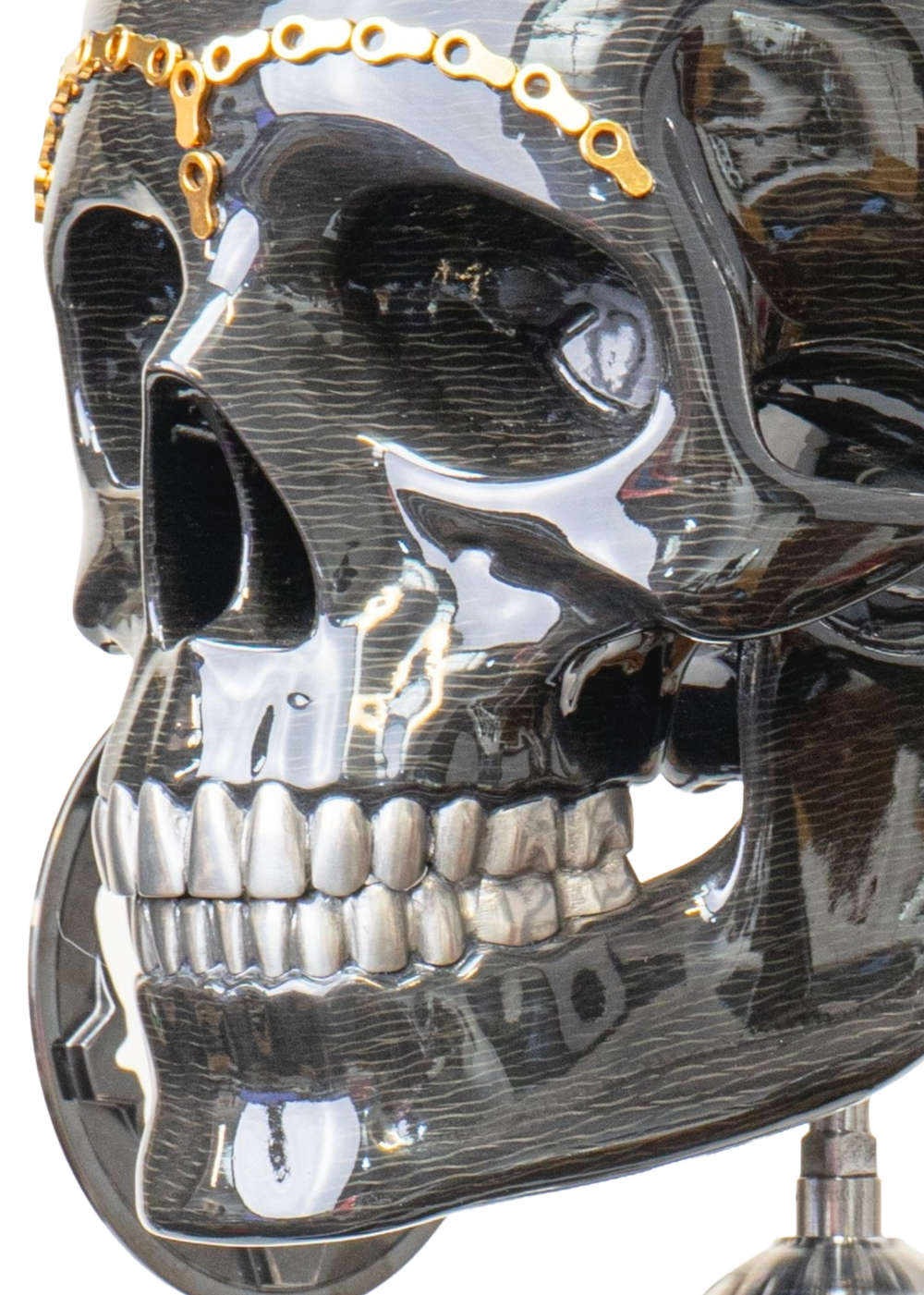 Alastair Gibson CarbonArt45 carbon fibre skull sculpture with high-gloss finish, Formula One components, stainless steel bolt crown detail, gold-plated accents and precision-engineered metal base