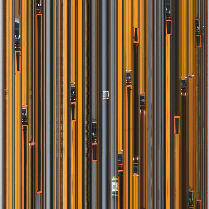 Richard P Jones City Climber #3, London fine art photographic print showing multiple glass elevators moving vertically through a modern architectural façade, created from reconstructed high-speed video imagery and printed as a giclée on brushed aluminium.