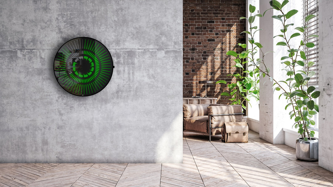 “Tempus Obsidian” by Ben Rousseau – a limited-edition illuminated wall timepiece crafted from grey mirrored glass and brass-tinted aluminium with LEDs. Inspired by obsidian, it radiates calm through subtle light and refined design.

