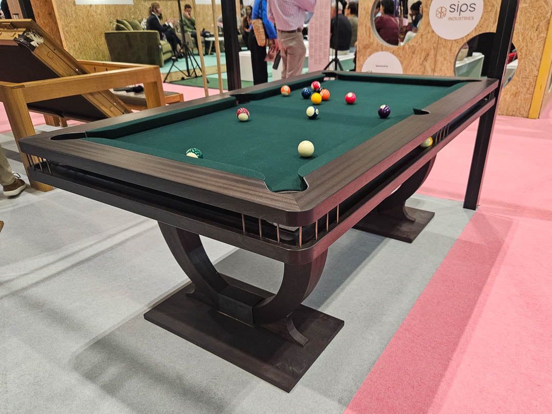 Sir William Bentley Billiards Continental BR 6ft pool table in black stained sapele with bronze detailing and green cloth, featuring sculptural art deco inspired legs.