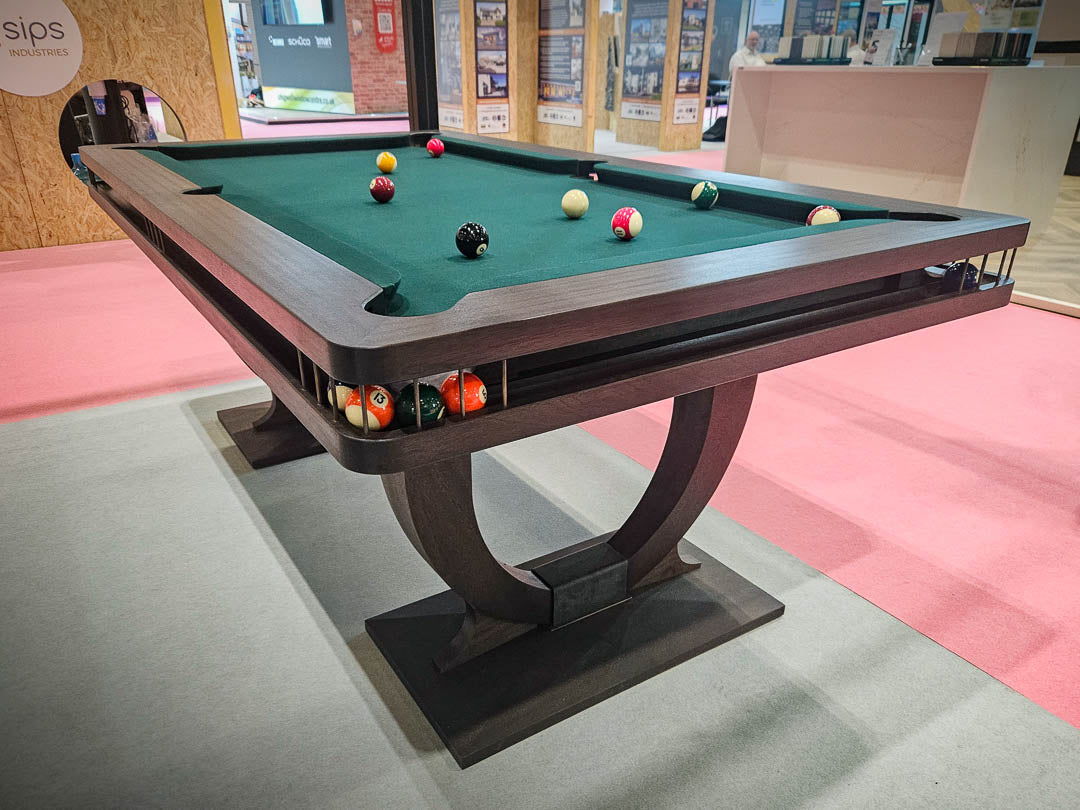 Sir William Bentley Billiards Continental BR 6ft pool table in black stained sapele with bronze detailing and green cloth, featuring sculptural art deco inspired legs.
