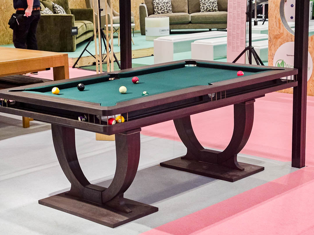 Sir William Bentley Billiards Continental BR 6ft pool table in black stained sapele with bronze detailing and green cloth, featuring sculptural art deco inspired legs.