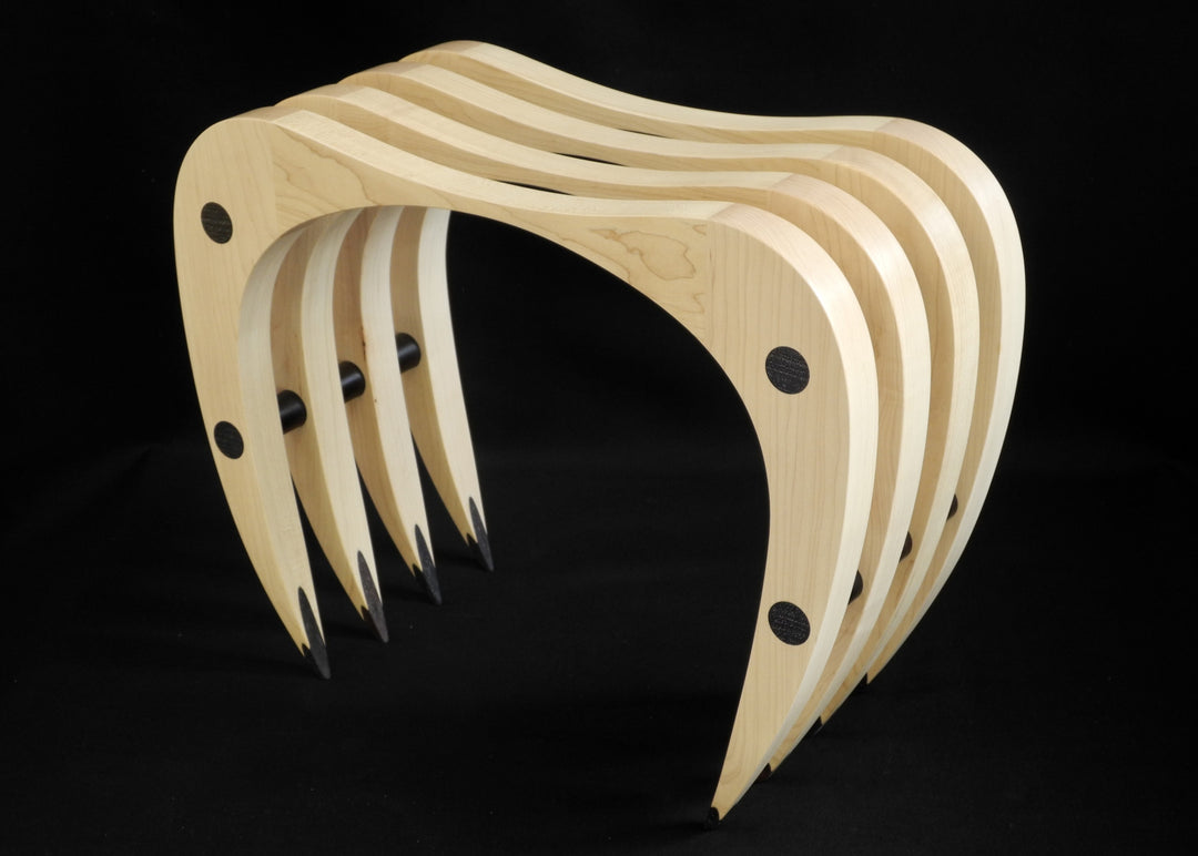 Crab Stool by Max McCance, a one-off sculptural seat in oak and lignum vitae, with curved arched legs that evoke the stance of a crab, combining fragility of form with surprising strength and comfort.
